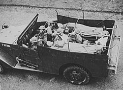 White scout car converted to ambulance.
